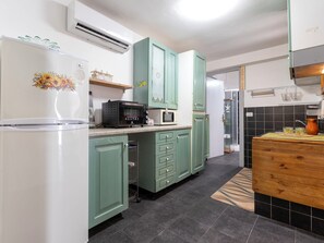 Fridge, microwave, cookware/dishes/utensils