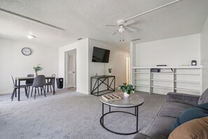 Smart TV, fireplace, books, offices