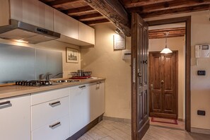 Fridge, stovetop, coffee/tea maker, cookware/dishes/utensils