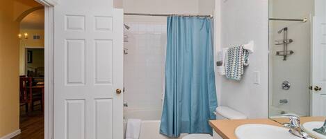Shower, hair dryer, towels, shampoo