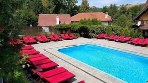 Seasonal outdoor pool, pool umbrellas, pool loungers
