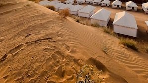 A desert landscape with white tents arranged in rows. - Hariyali Dhani Camps & Desert Resort With Swimming Pool, Jodhpur (Dheerpura)