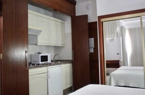 Fridge, microwave, coffee/tea maker, cookware/dishes/utensils