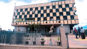 A multi-story building with a patterned facade, labeled "SANMALA HOTEL & RESTRO."