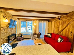 Apartment, 1 Queen Bed with Sofa bed, Non Smoking, Pets not allowed | Living area | 43-inch Smart TV with cable channels, fireplace