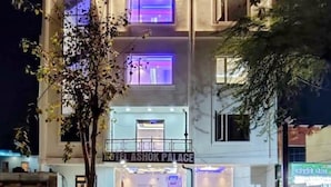 A multi-story building with a sign reading "HOTEL ASHOK PALACE." - Hotel Ashok Palace Near Taj Mahal  Agra (Agra)