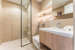 Shower, hair dryer, towels, soap