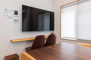 Premier House, 4 Bedrooms | Living area | 55-inch flat-screen TV with digital channels