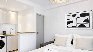 Superior Apartment, Courtyard View | Living area | 80-cm Smart TV with digital channels