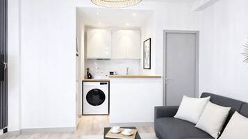 Superior Apartment, Courtyard View | Living area | 80-cm Smart TV with digital channels