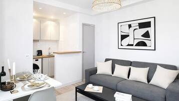 Superior Apartment, Courtyard View | Living area | 80-cm Smart TV with digital channels