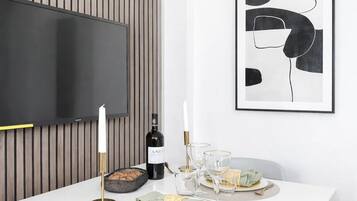 Superior Apartment, Courtyard View | Living area | 80-cm Smart TV with digital channels