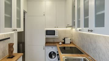 Deluxe Apartment, Courtyard View | Living area | 107-cm Smart TV with digital channels