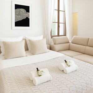 Deluxe Apartment, Courtyard View | Living area | 107-cm Smart TV with digital channels