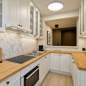 Deluxe Apartment, Courtyard View | Private kitchen | Espresso maker, electric kettle