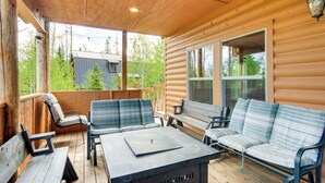A covered outdoor seating area with wooden benches and a table, overlooking a forested area. - Brian Head Cabin < 1 Mi to Resort: Ski + Mtn Bike (Brian Head)