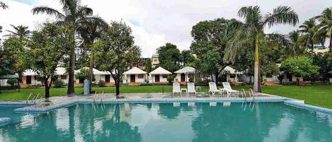 Seasonal outdoor pool, pool umbrellas, pool loungers