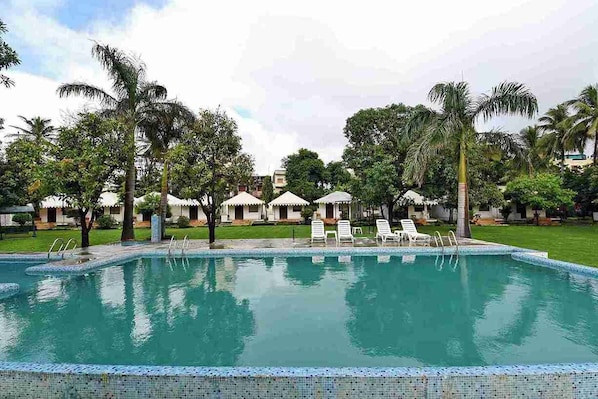 Seasonal outdoor pool, pool umbrellas, pool loungers