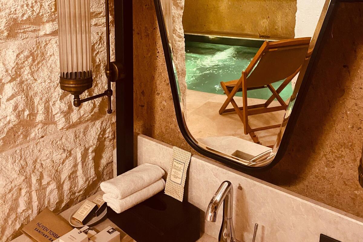 Superior Suite | Bathroom | Hair dryer, slippers, towels, soap