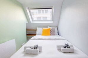 1 bedroom, desk, iron/ironing board, travel crib