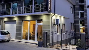 A modern two-story building with a sign reading "Villa Vratnica restaurant & apartments." - Villa Vratnica - Restaurant & Apartments (Vratnica)