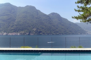 Apartment, Patio, Lake View | Iron/ironing board, cots/infant beds, free WiFi, bed sheets