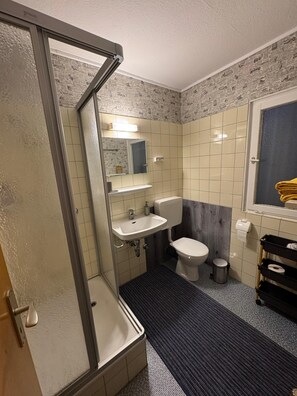 Shower, hair dryer, towels, soap
