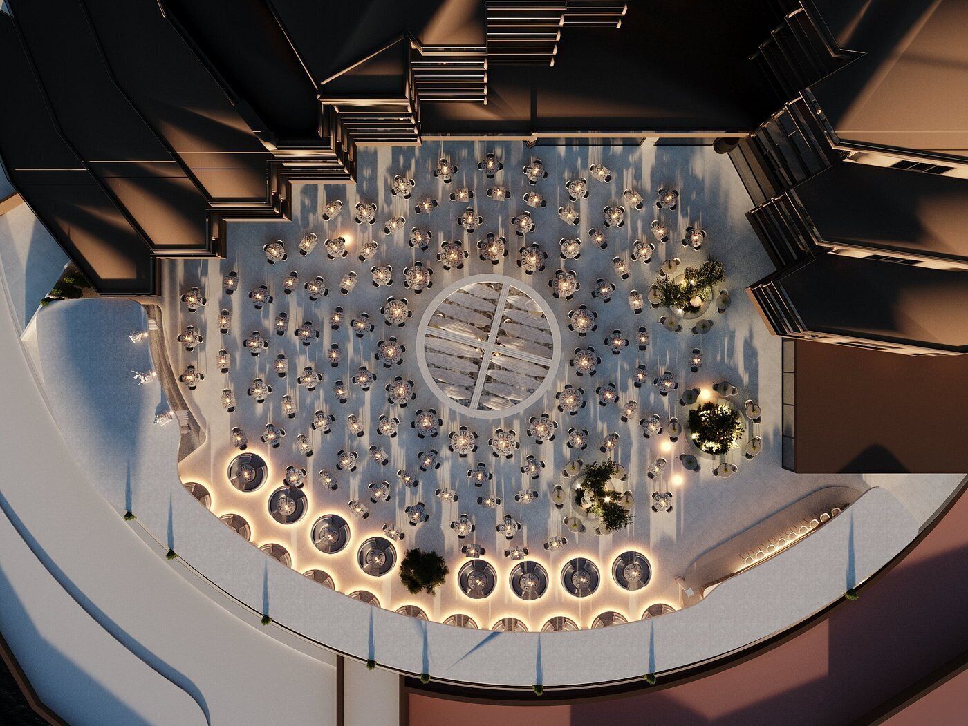An aerial view of a circular outdoor seating area with multiple tables and chairs, surrounded by a low wall.