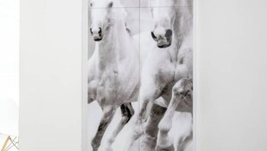 A wall with a large, abstract painting of horses. - Estia apartment (Athina)