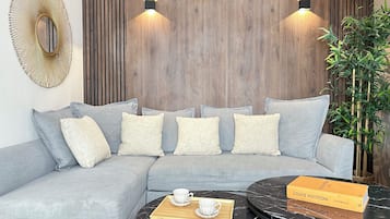 Deluxe Duplex, City View | Living area | 80-cm Smart TV with digital channels