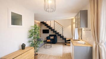 Deluxe Duplex, City View | Living area | 80-cm Smart TV with digital channels