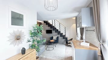 Deluxe Duplex, City View | Living area | 80-cm Smart TV with digital channels