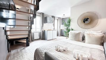 Deluxe Duplex, City View | Living area | 80-cm Smart TV with digital channels