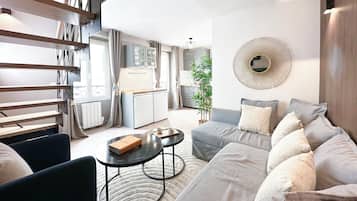 Deluxe Duplex, City View | Living area | 80-cm Smart TV with digital channels