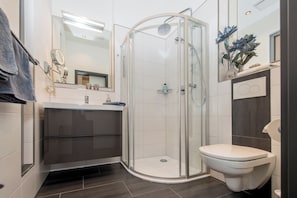 Shower, hair dryer, towels, soap