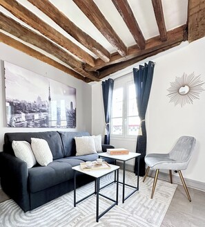 Superior Apartment, City View | Living area | 80-cm Smart TV with digital channels