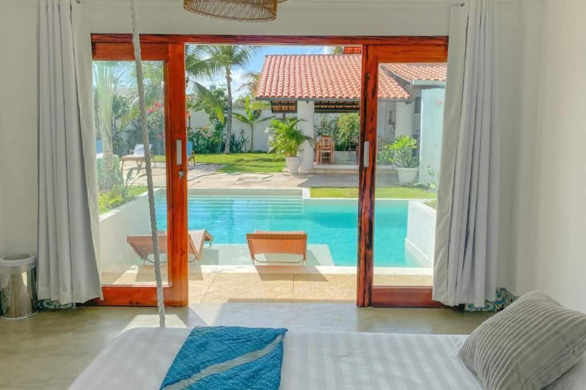 Deluxe Quadruple Room, Balcony, Pool View | Desk, laptop workspace, free WiFi