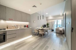 Fridge, microwave, oven, stovetop - Airstay | 1BR | Pool Views | Next to Circle Mall (Dubai)
