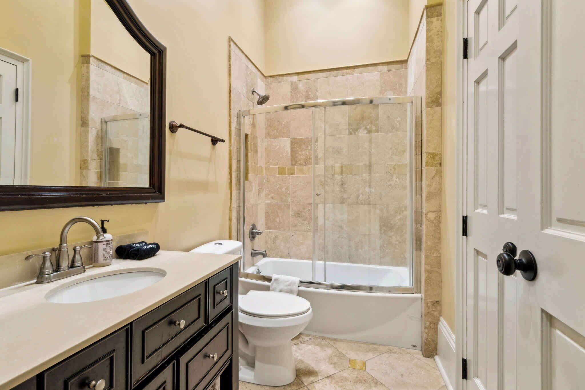 Shower, hair dryer, towels, shampoo