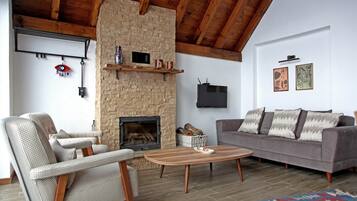 60-inch LCD TV with satellite channels, fireplace, heated floors