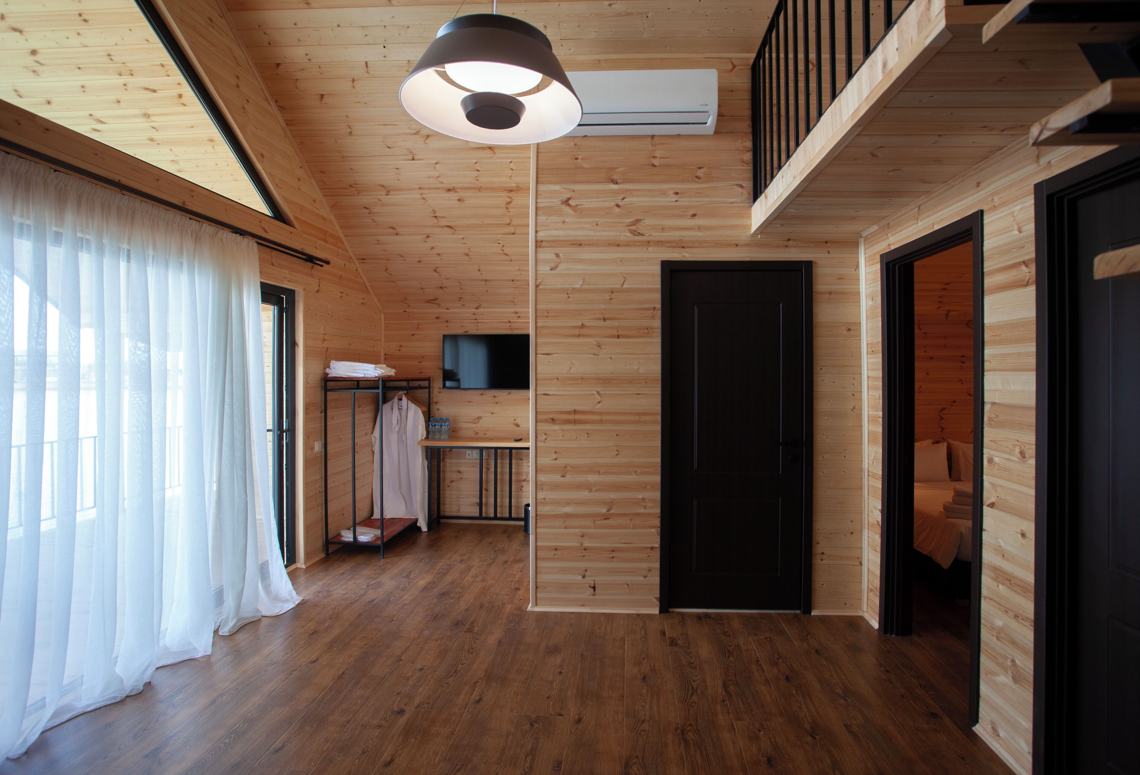 Basic Chalet, Balcony, Lake View | Living area | 15-inch flat-screen TV with digital channels