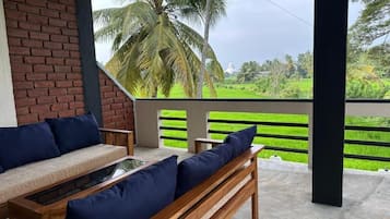 Deluxe Double Room, Balcony | Living area | Fireplace