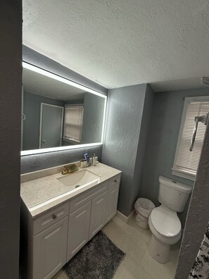 Hair dryer, towels, soap, toilet paper