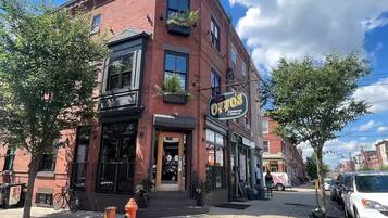 A brick building with a sign for 'Otto's Taproom & Grill'.