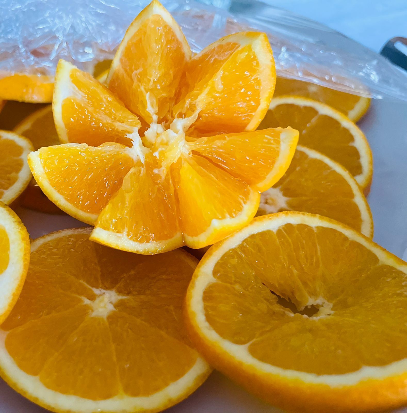 A close-up of sliced oranges arranged on a surface.