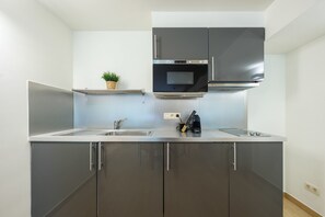 Fridge, microwave, coffee/tea maker, toaster