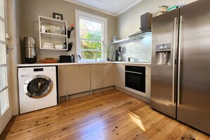 Fridge, oven, dishwasher, dining tables
