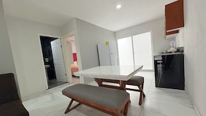 A modern kitchen with a white countertop, a built-in oven, and a refrigerator. - Residencial Gran Cobae Triplex A (Tonalá)