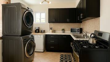 Mini-fridge, microwave, stovetop, cookware/dishes/utensils