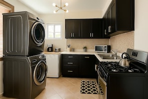 Mini-fridge, microwave, stovetop, cookware/dishes/utensils